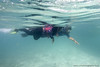 On the final day of the Soneva Learn-To-Swim programme, the mothers' class go snorkelling.  For most of the women, this is their first time seeing the reef edge. Instructor and Soneva naturalist Georgina White points out different coral and fish.
