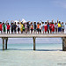 The children's class wave goodbye at the conclusion of the Soneva Learn-To-Swim programme
