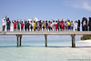 The children's class wave goodbye at the conclusion of the Soneva Learn-To-Swim programme