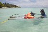Twins Irene and Ida go snorkelling for the first time with instructor Georgina White as part of the Soneva Learn-To-Swim programme
